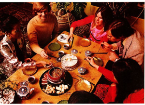 People having a fondue party.